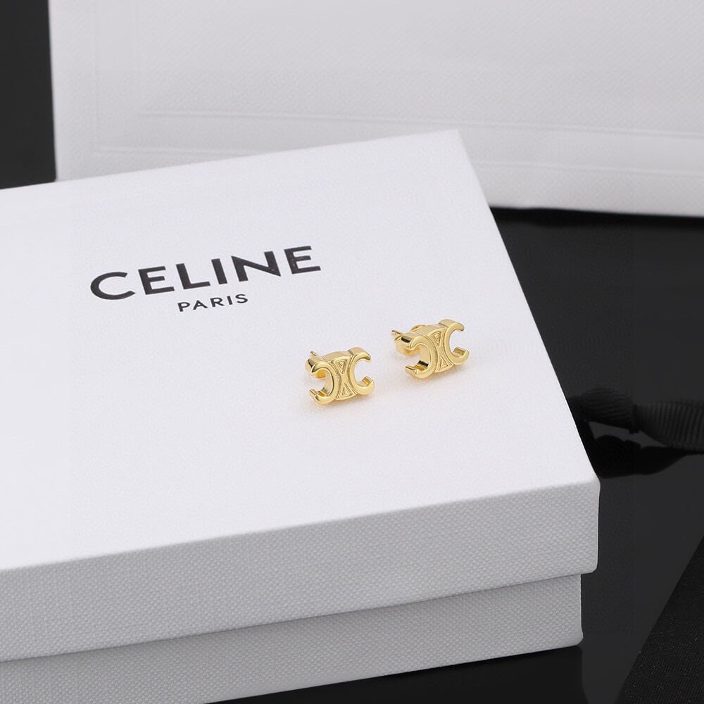 Ce**e triomphe studs in brass with gold finish