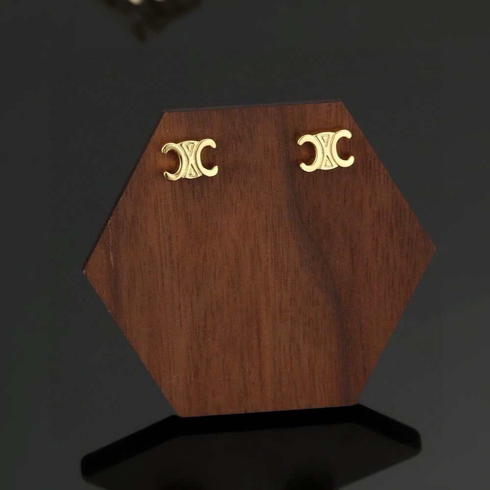 Ce**e triomphe studs in brass with gold finish